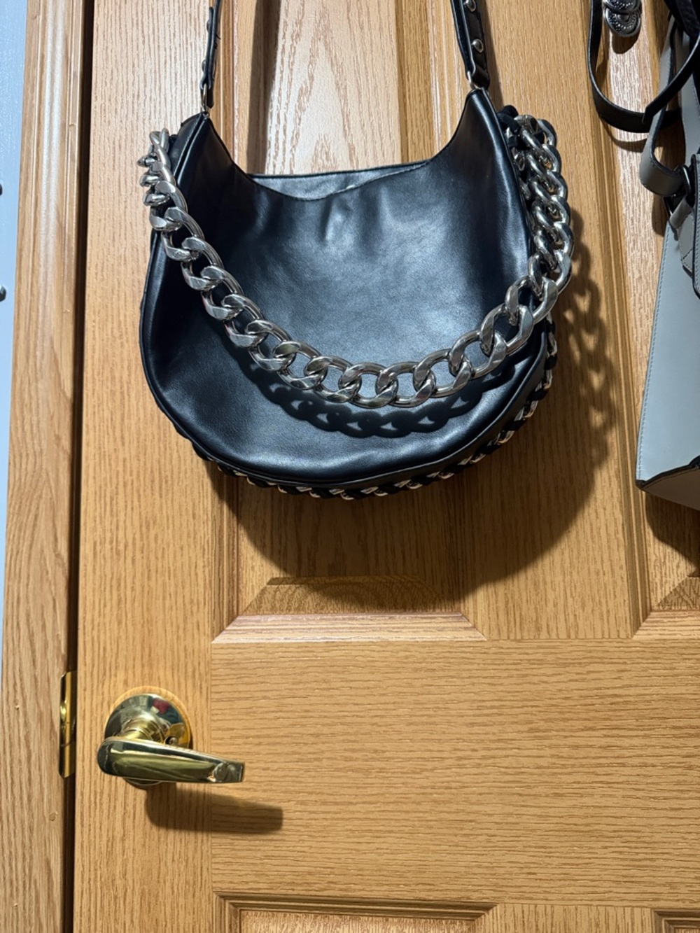 Black Leather Crossbody Bag with Silver Chain Accent - Picture 7 of 8